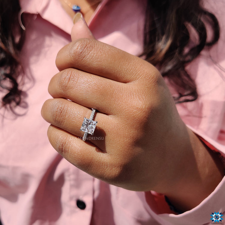 Moissanite ring UK design with princess cut and pave side band.