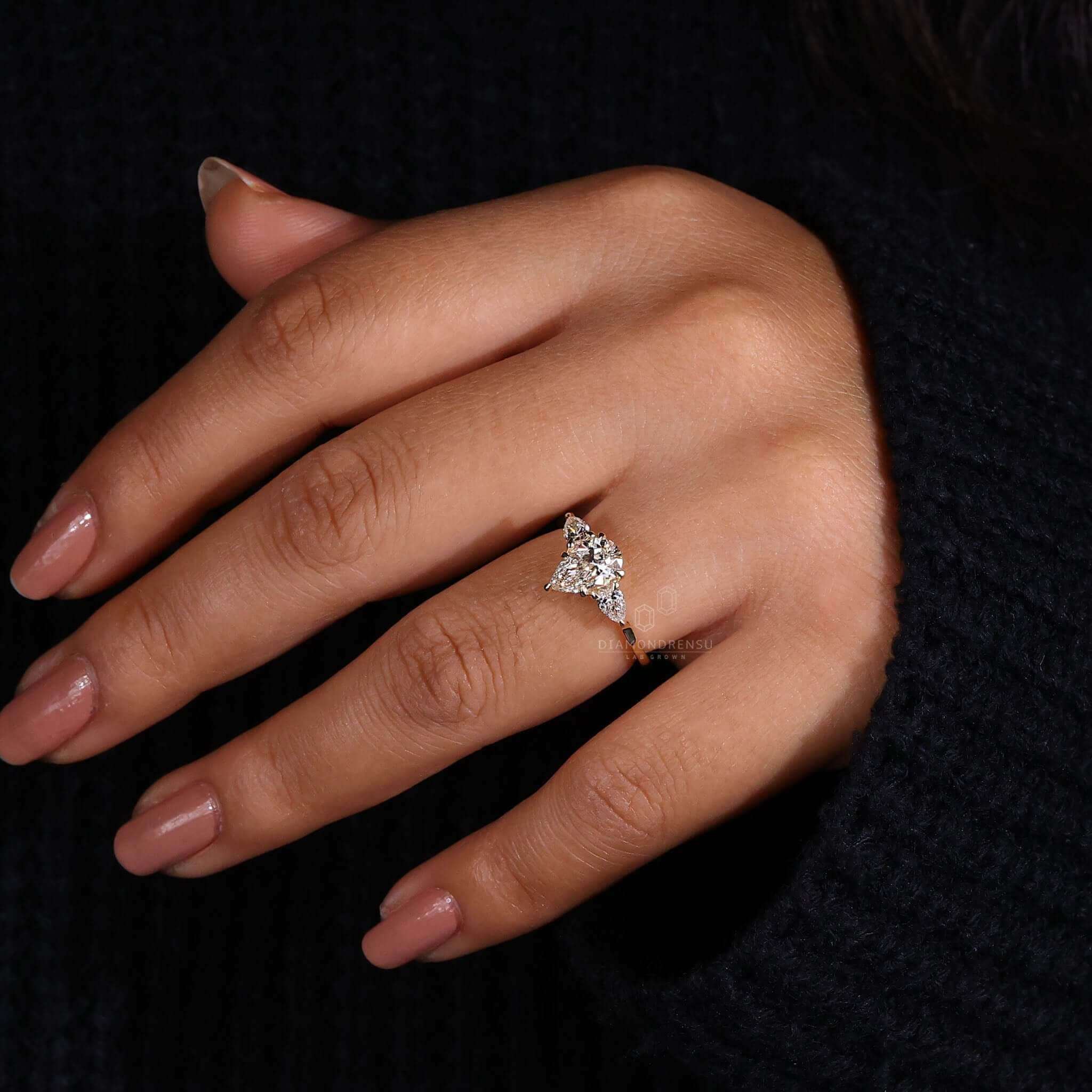 Pear diamond engagement ring featuring a 4-prong claw setting.