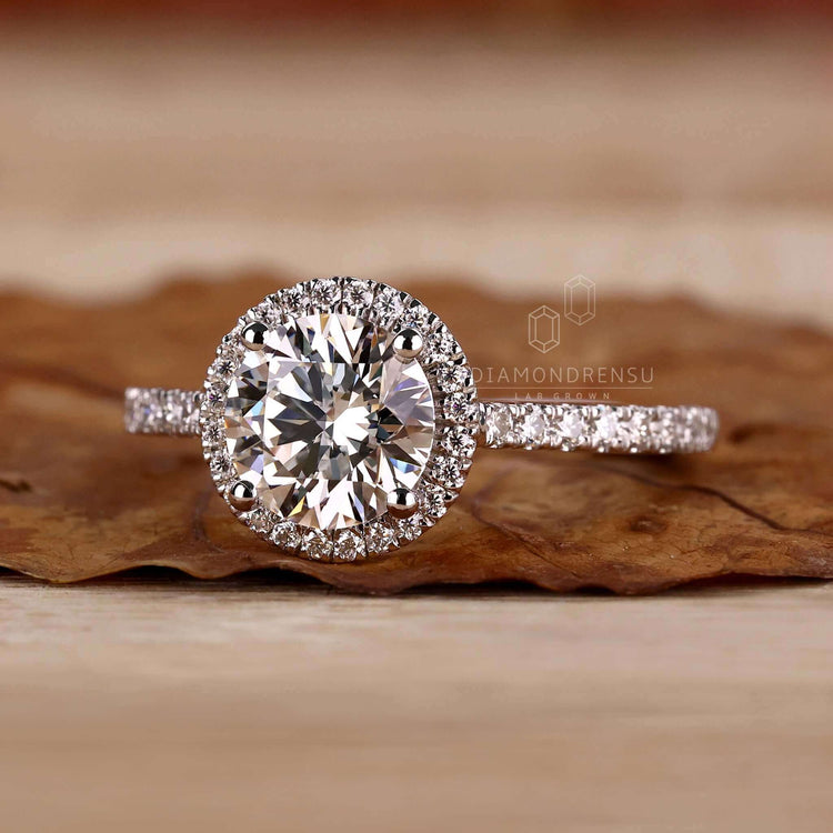 Halo diamond ring with exquisite detailing and brilliance.