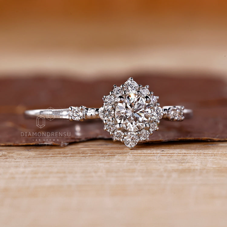 Diamond cluster ring with intricate detailing.