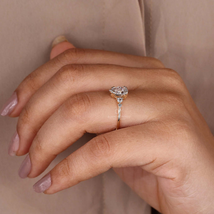 Round diamond ring featuring a pear shaped engagement design in IGI certified lab grown diamonds.