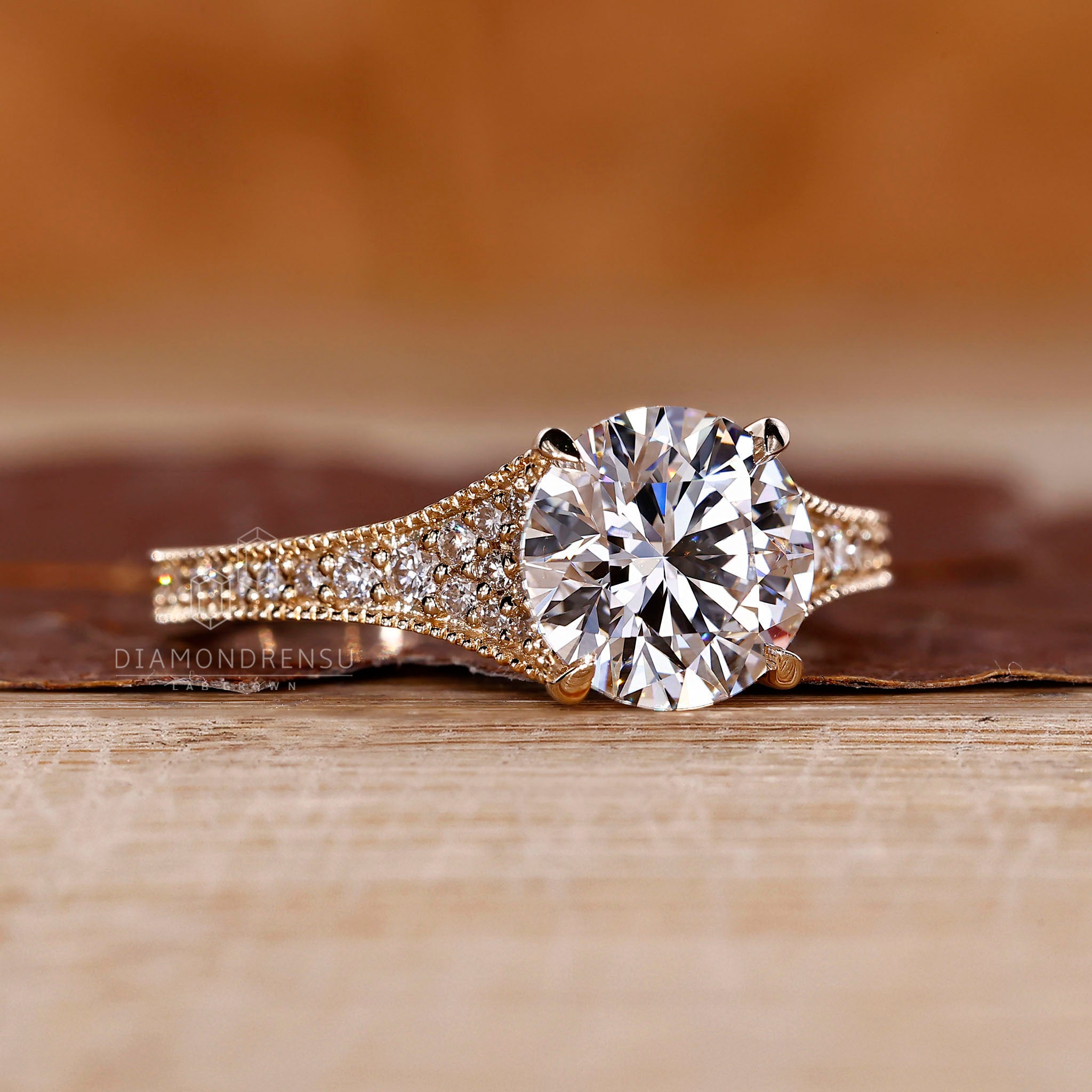 4 claw prong setting ring holding a clear diamond.