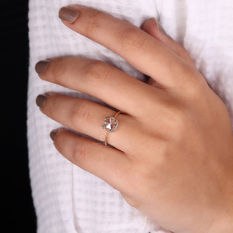 Yellow gold ring with solitaire rose cut diamond and hart shape prong set.