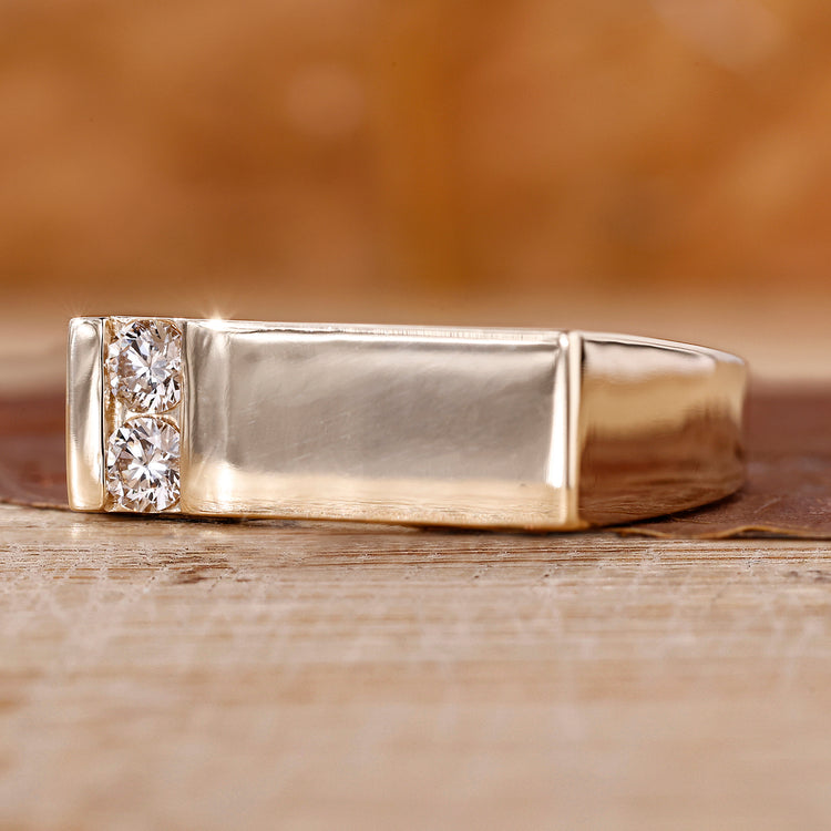 Mens signet ring crafted in yellow gold with two round Lab Grown Diamonds.