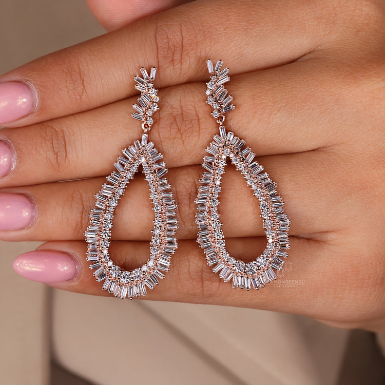 Custom earrings with baguette and round diamonds.