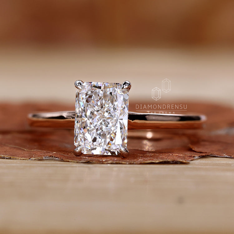 Cathedral style radiant diamond ring design.