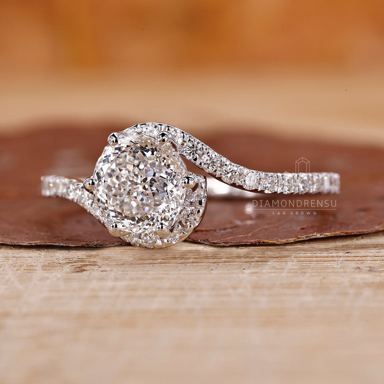 UK engagement ring includes Portuguese cut and halo style.