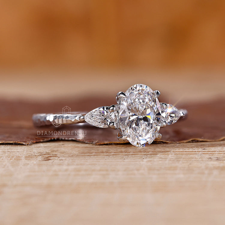Handmade ring featuring oval cut diamond ring style.