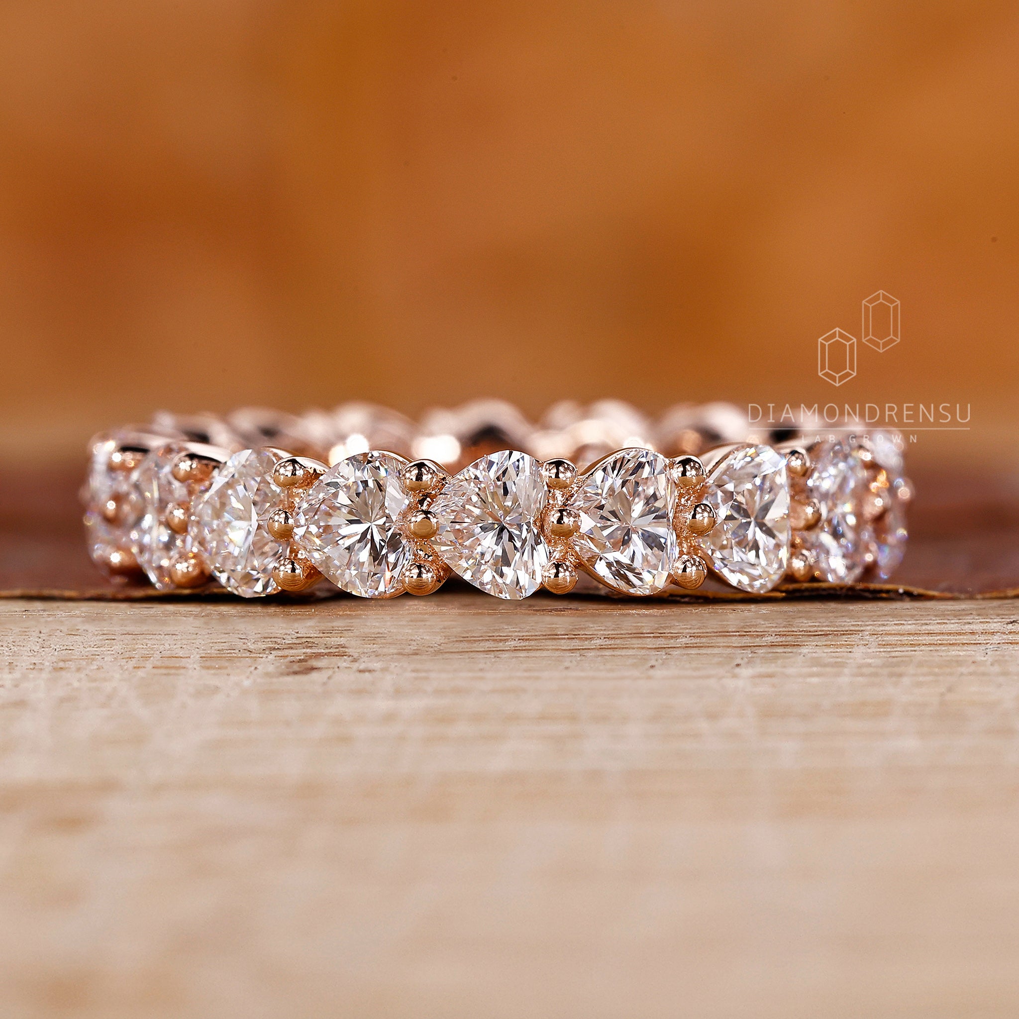 Round prong setting heart diamond band.