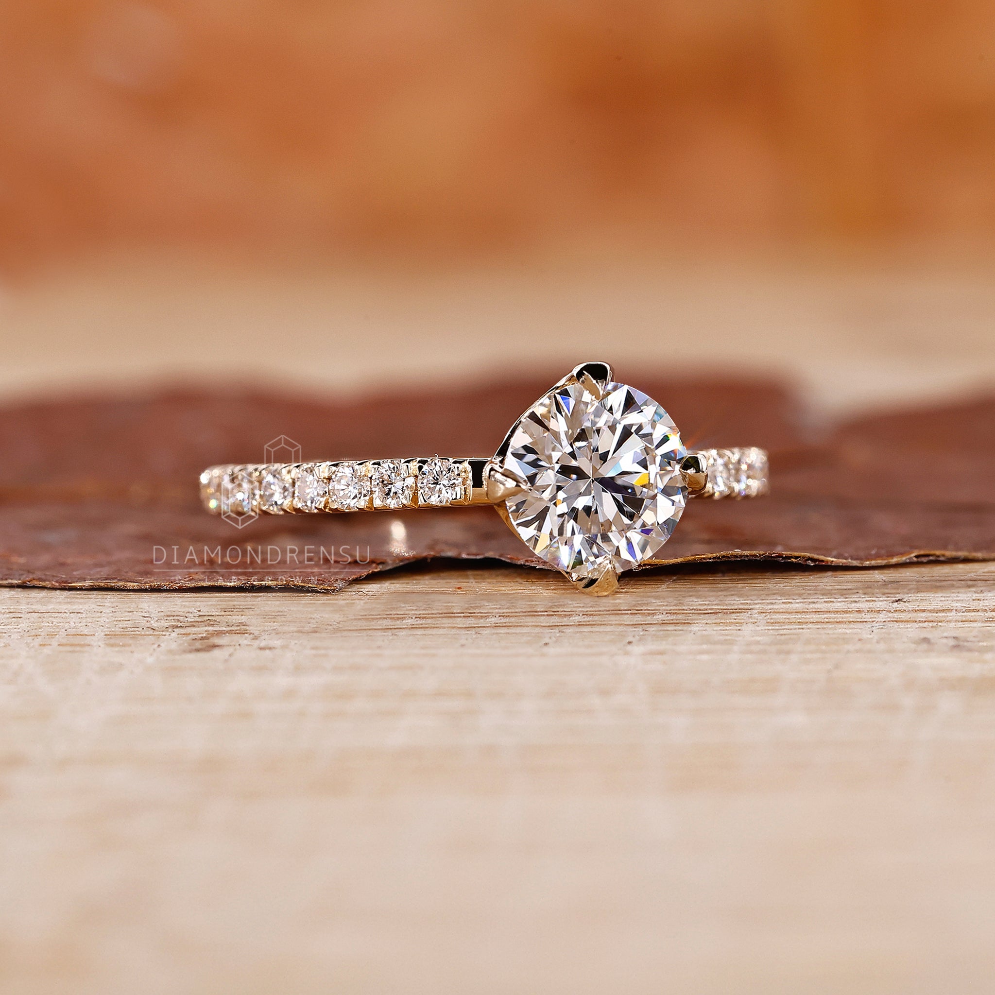 Diamondrensu UK engagement ring with lab diamond and four claw prong set.