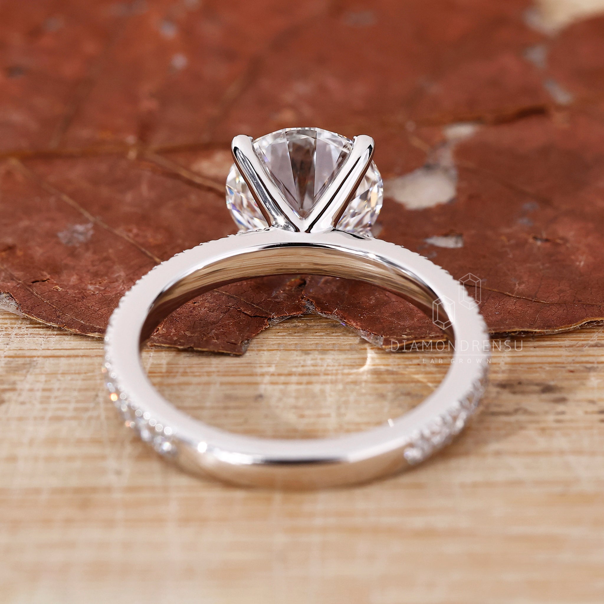 Lab grown round diamond in a white gold pavé band.