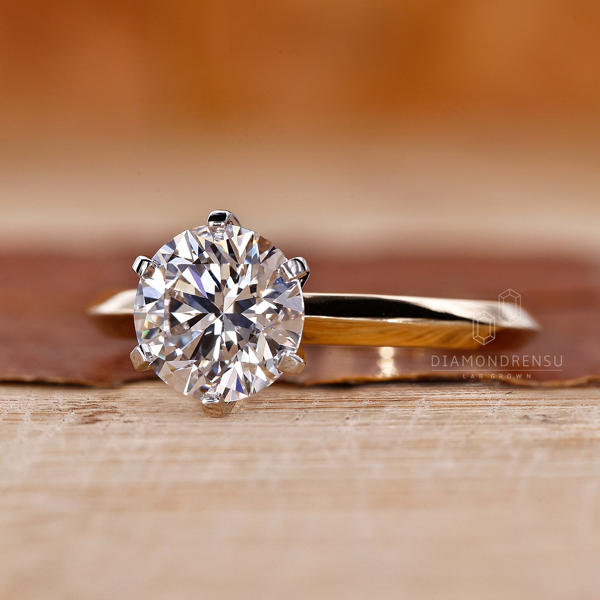 White and yellow gold ring with solitaire centre and custom setting.