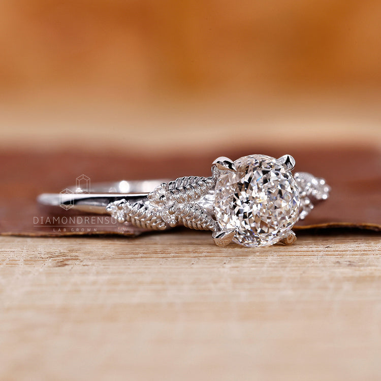 IGI certified lab diamond ring with leaf ascent and four claw prong.