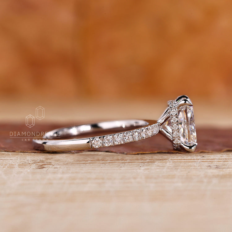 White gold ring with round diamond hidden halo and IGI certified lab stone.