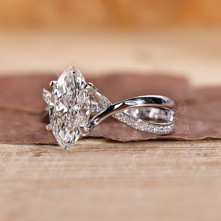 White gold engagement ring with round cut pave and claw prong setting.
