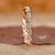 Twisted diamond wedding band in yellow gold.
 Twisted diamond wedding band in yellow gold.