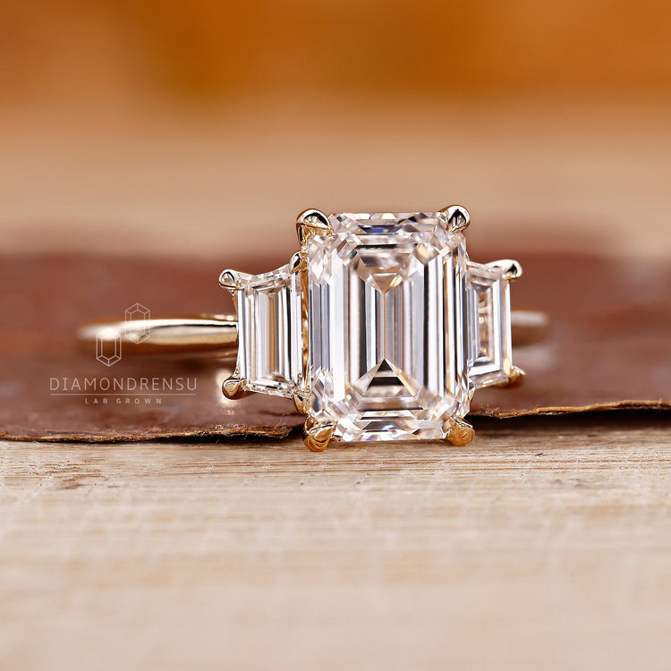 Cathedral setting holds all three diamonds in place.