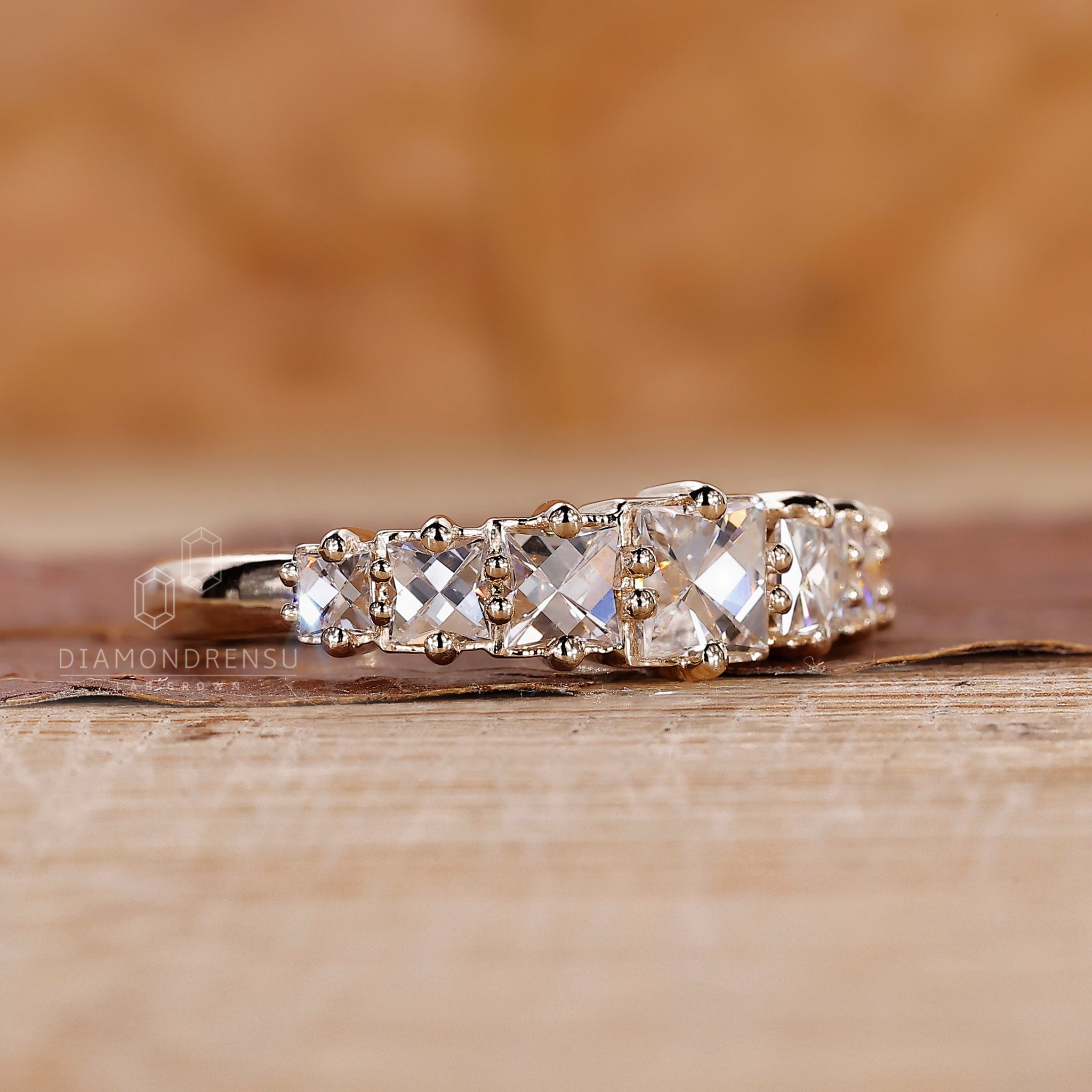 Buy wedding band with seven lab grown stones in yellow gold.