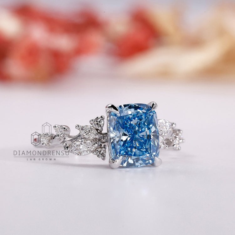 Custom diamond ring with marquise and round accents in white gold.