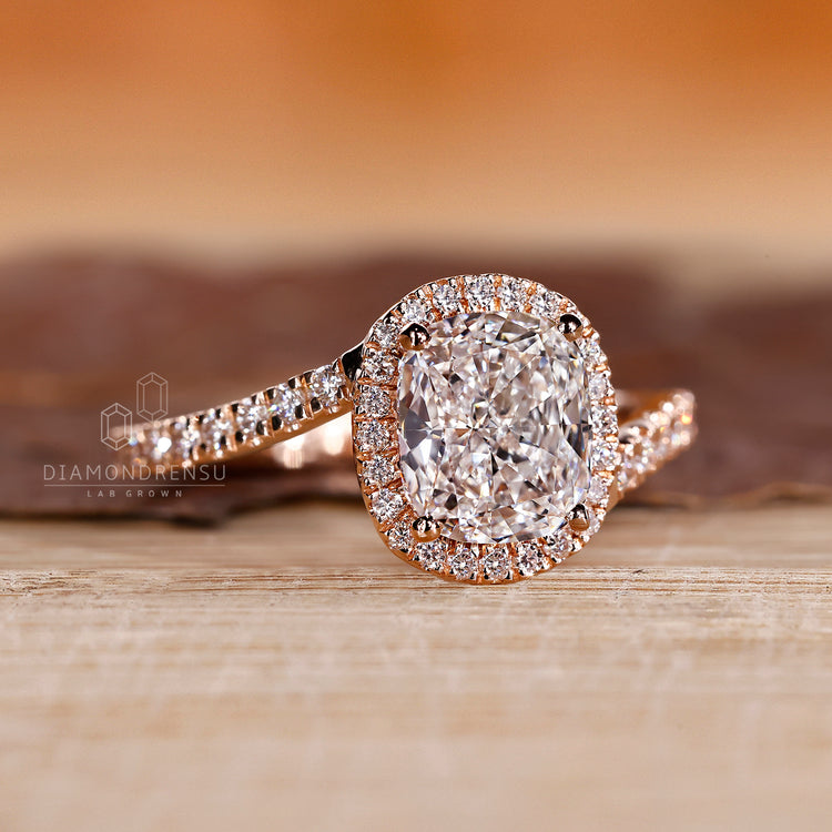 Bypass setting ring with four prong cushion diamond.