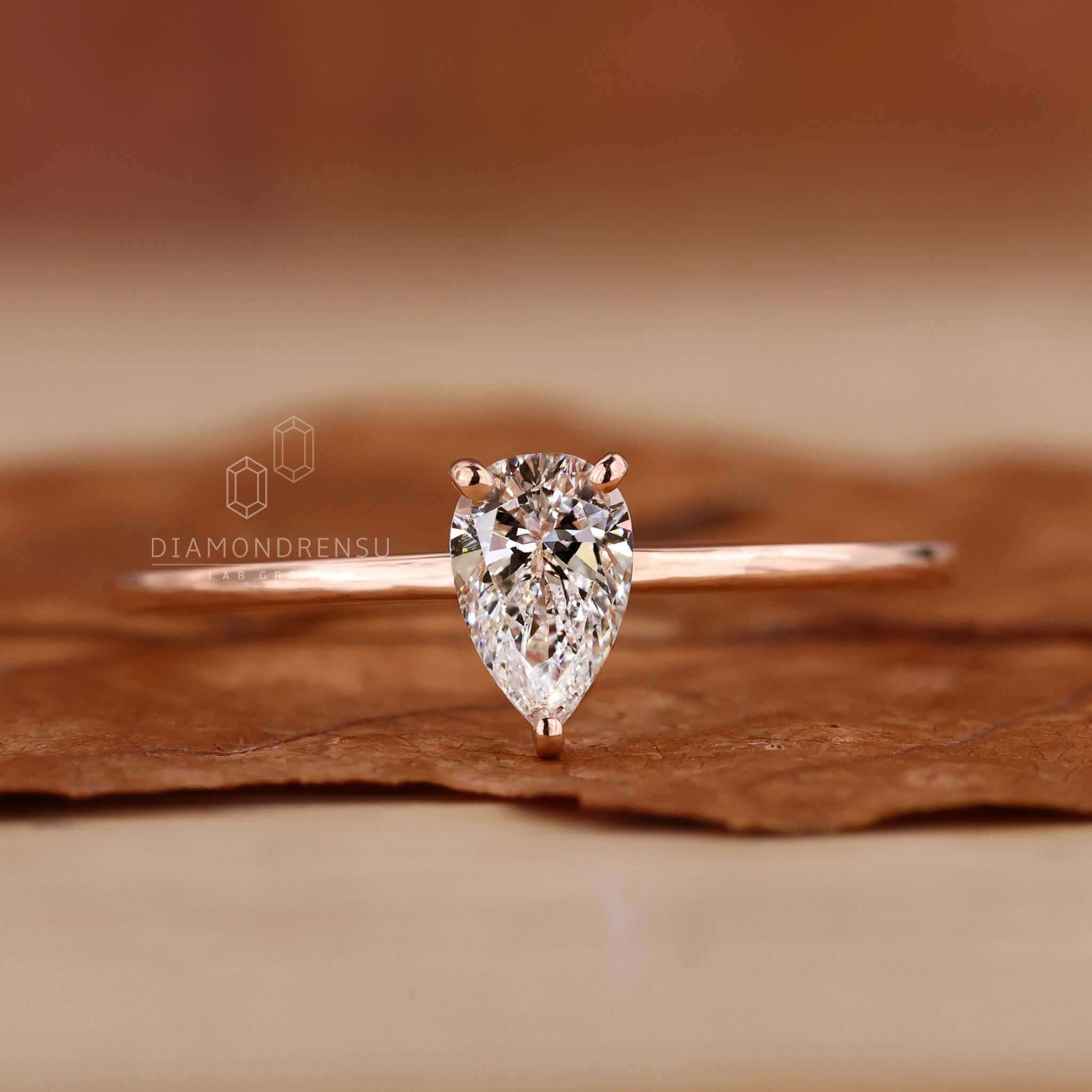 Pear shaped ring diamond set in a beautifully crafted UK engagement ring.