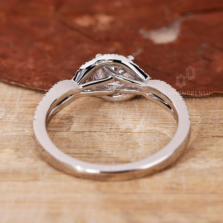 Lab grown diamond set in a twisted pave ring style.