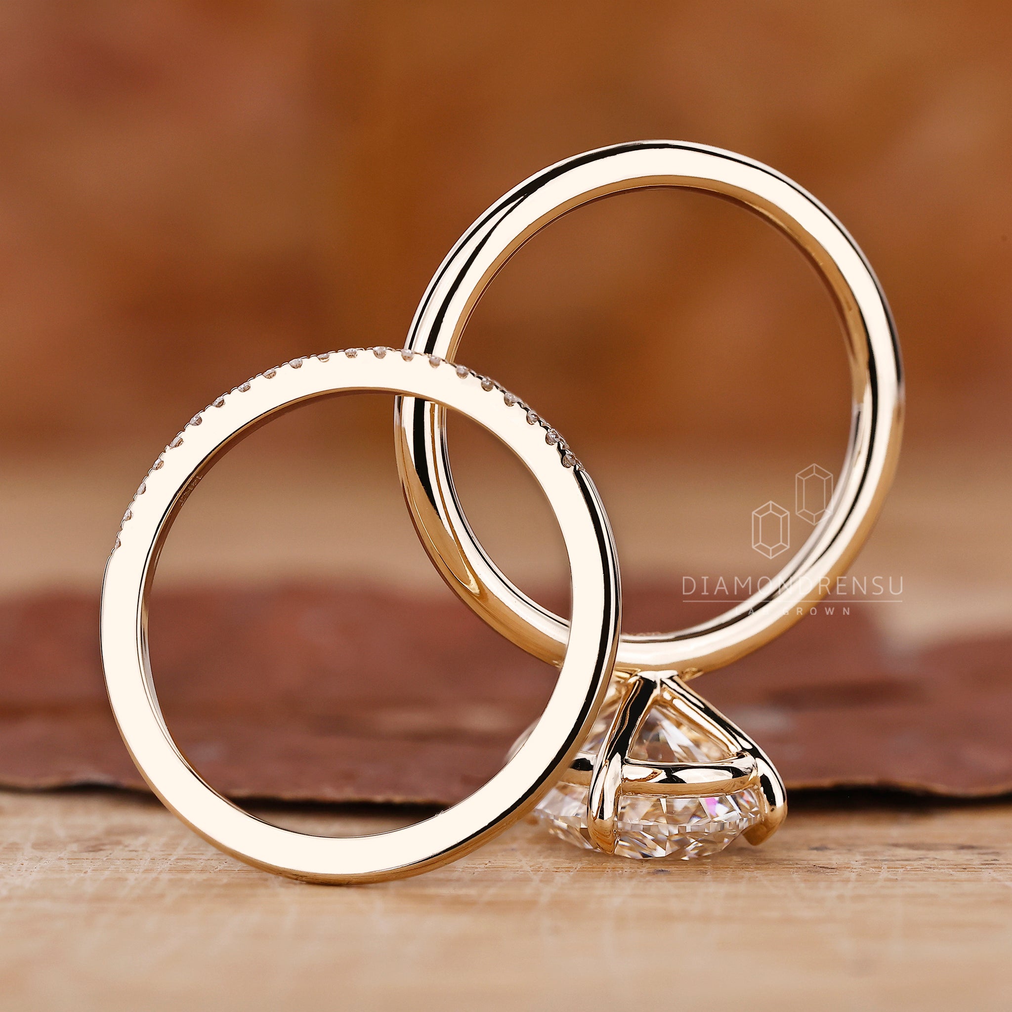 Half eternity wedding band with lab grown diamond and oval engagement ring.