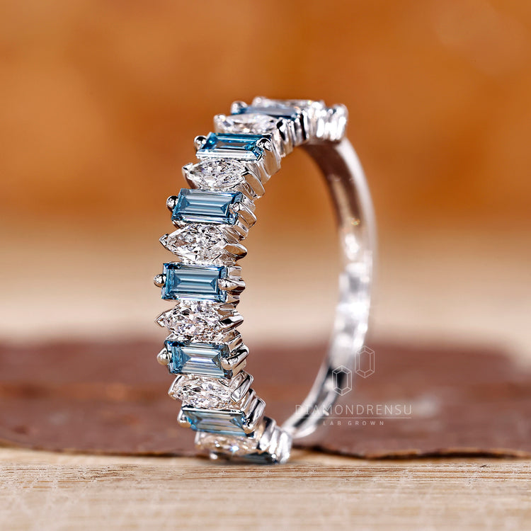 Buy wedding band featuring a custom mix of marquise and baguette diamonds.