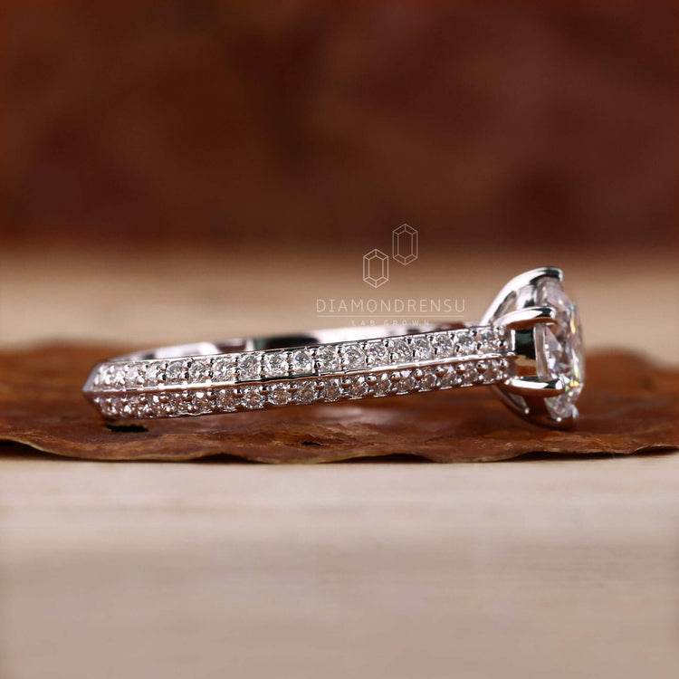 Round diamond ring with a pave setting, creating a unique engagement ring perfect for proposals and special moments.