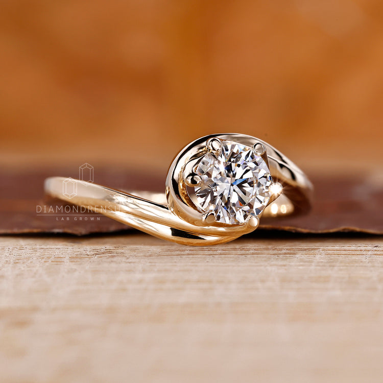 Yellow gold solitaire ring with clean prong setting.