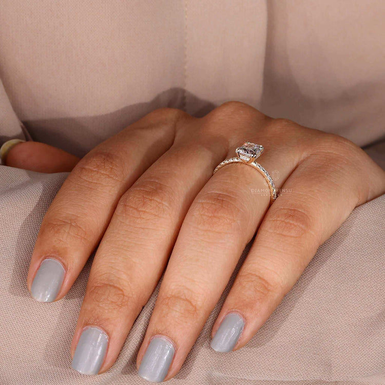 Engagement ring hidden halo with pave ring diamond elements.