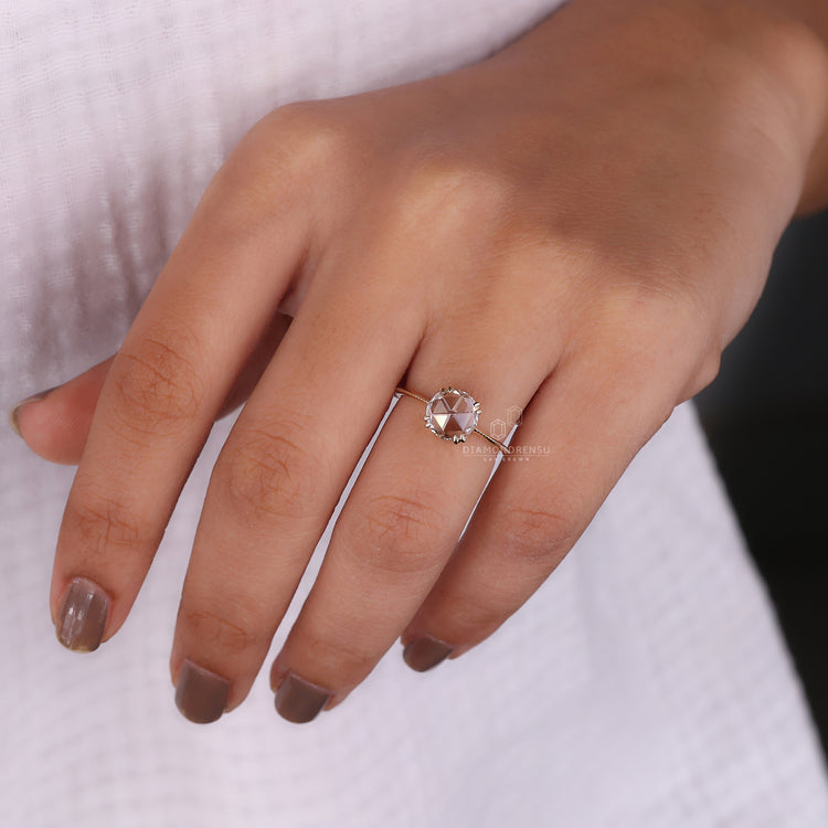 Solitaire diamond ring in yellow gold with hidden heart setting design.