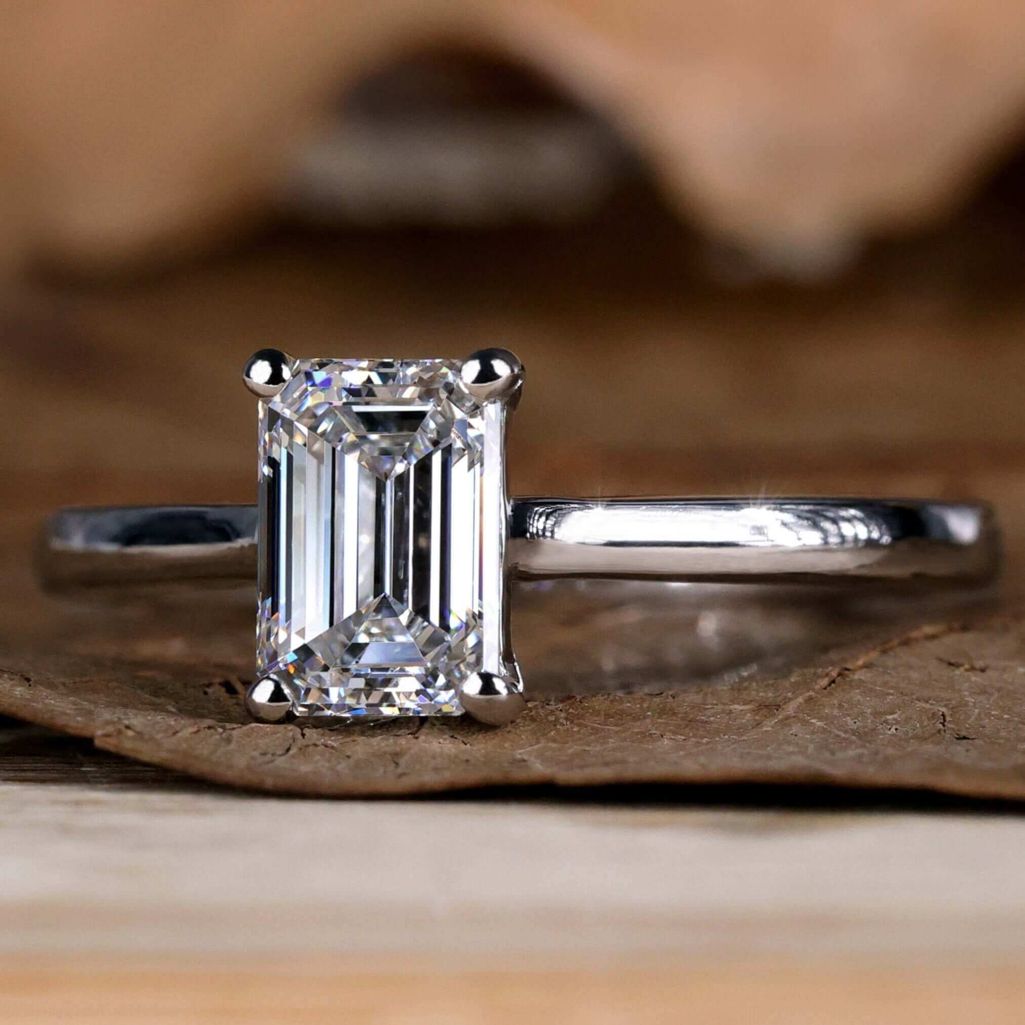 Elegant emerald cut diamond ring with sparkling finish.