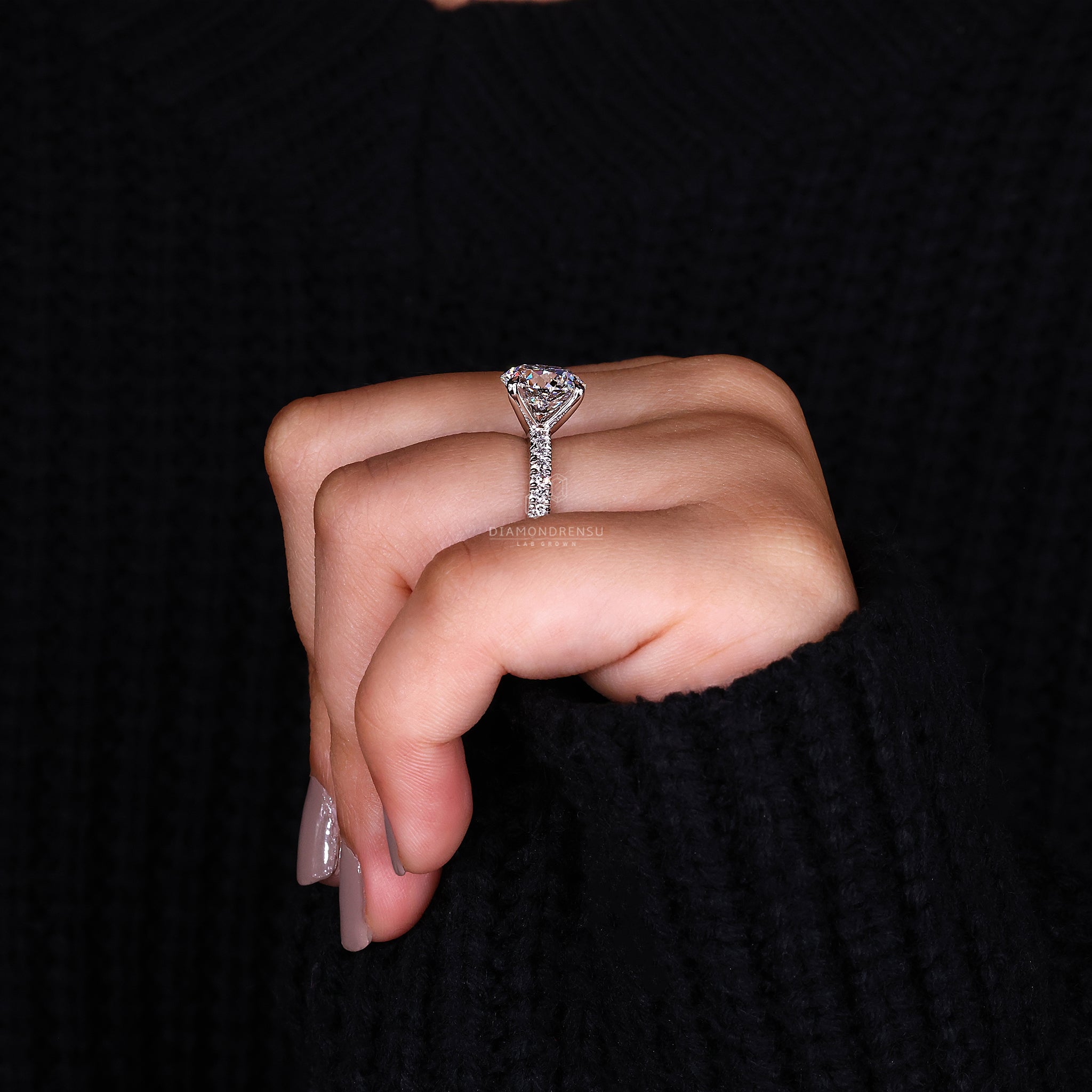 Handmade ring featuring a 4 claw setting and pavé style.