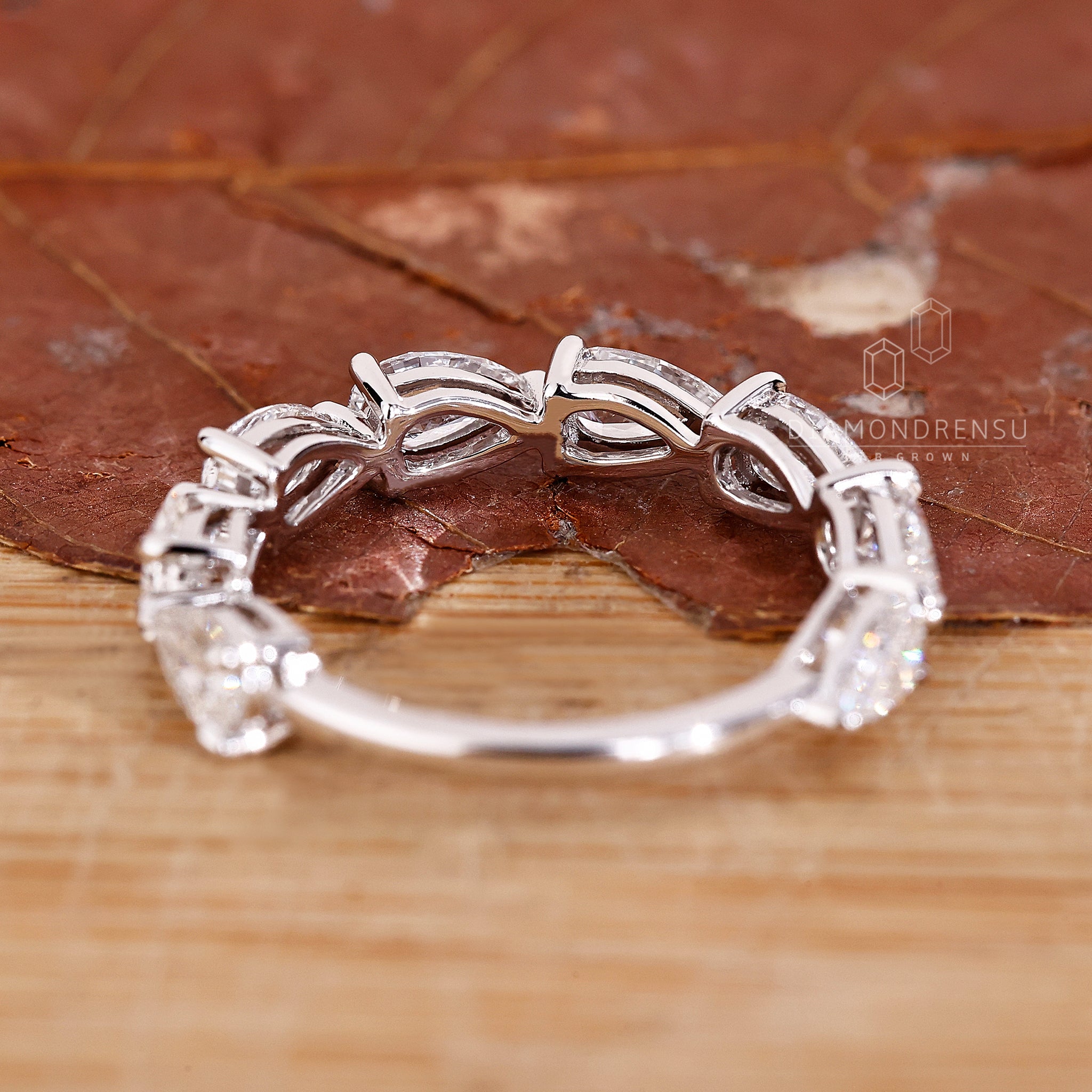 Elegant East to West diamond wedding ring.