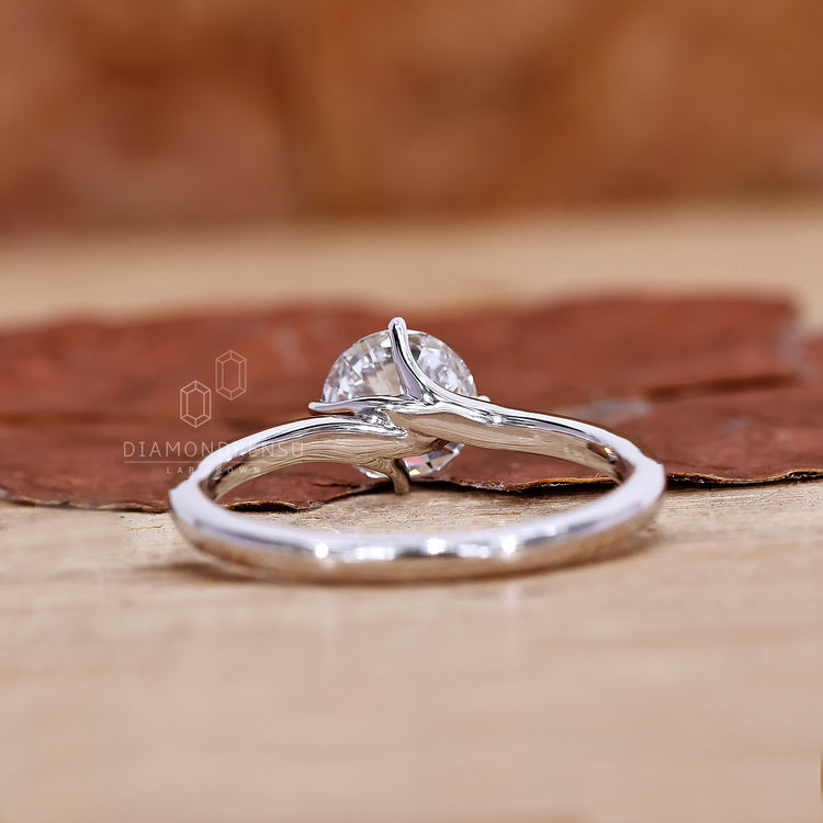 UK engagement ring with compass prong setting.