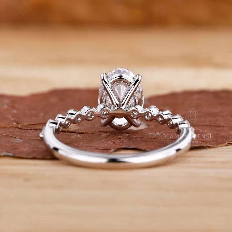 UK engagement ring designed with floating bubble prong.