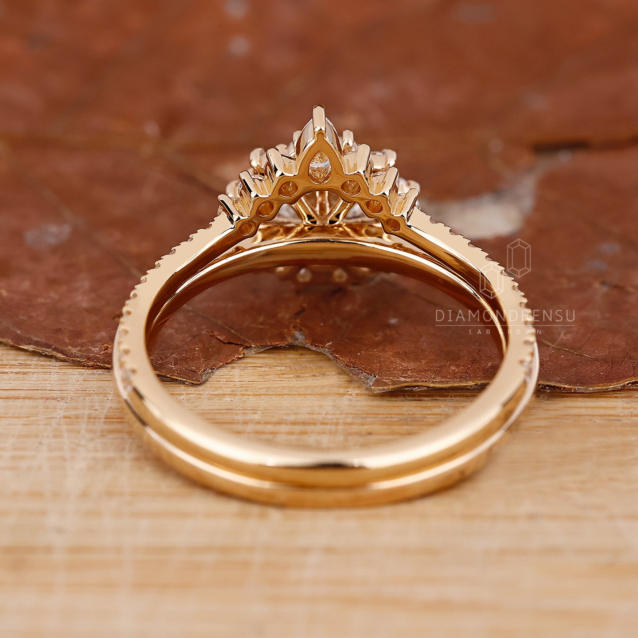 Round engagement ring with curved half eternity diamond band.