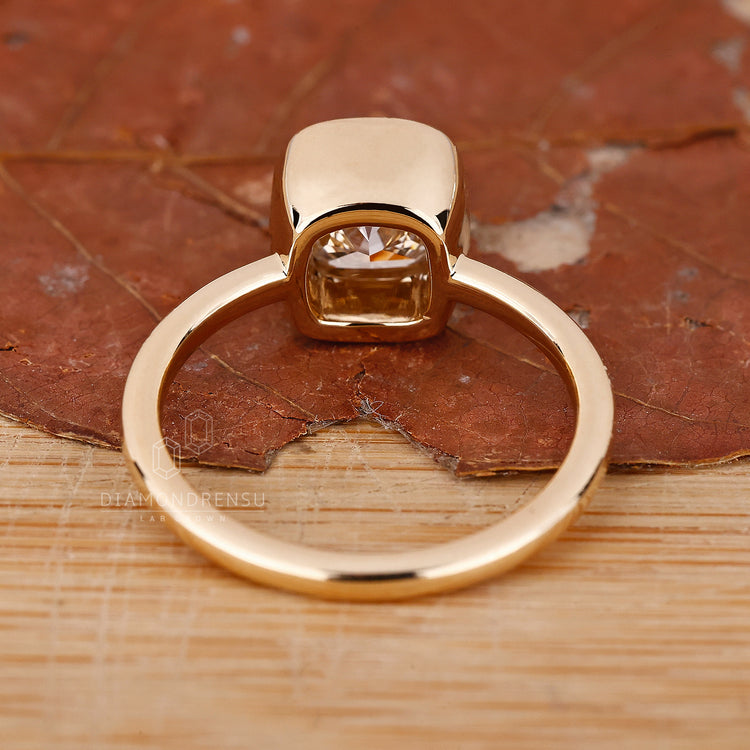 Lab Grown Diamond is used in this cushion cut solitaire engagement ring.