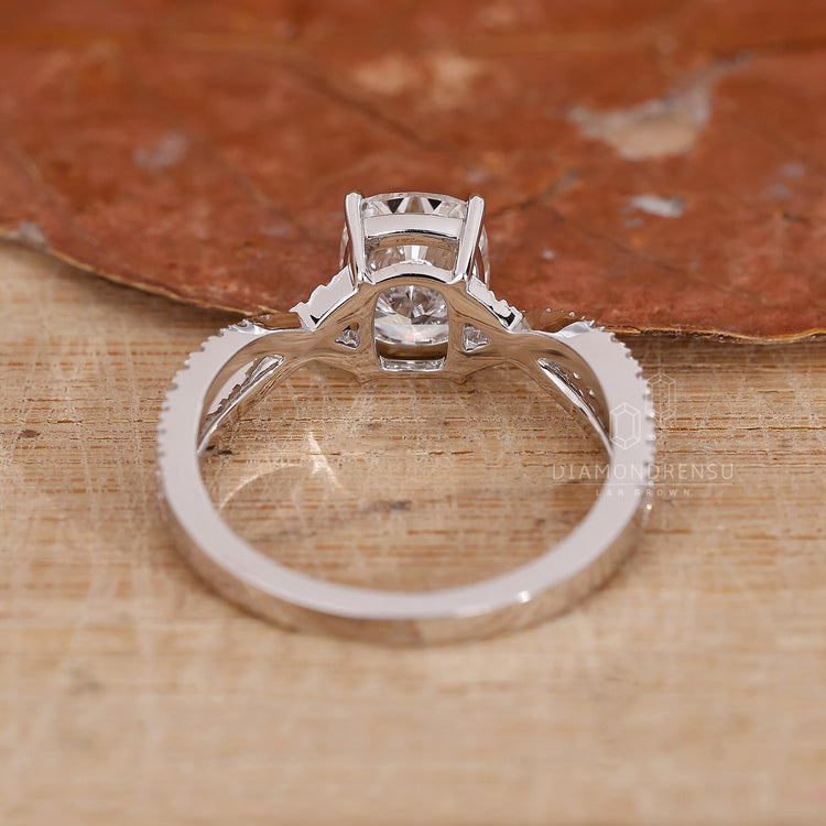 Custom UK engagement ring in a twisted pavé design.