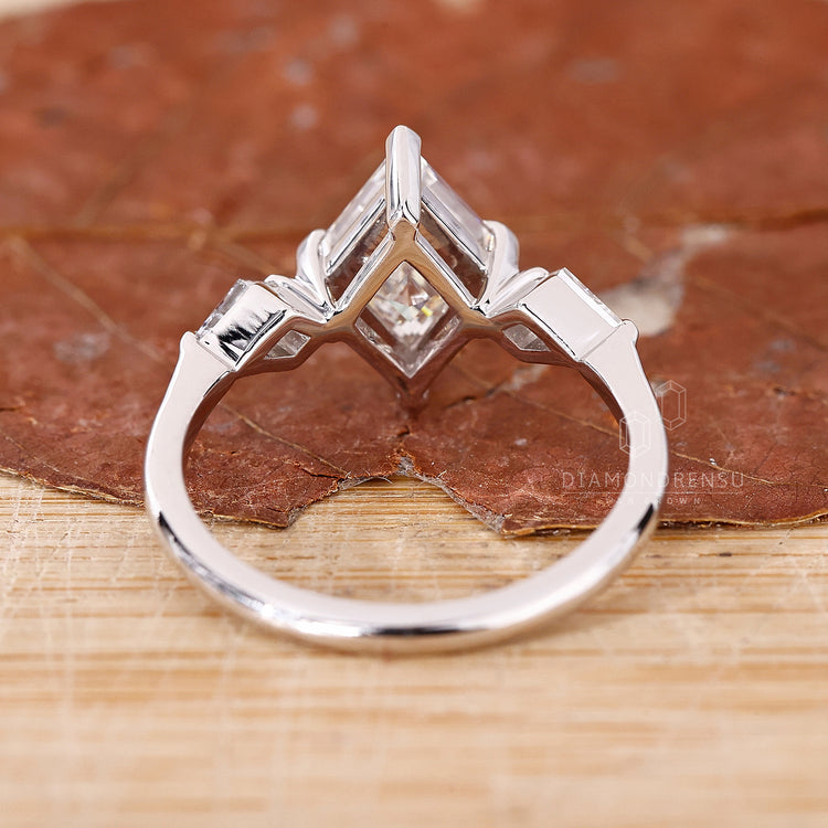Custom engagement ring with compass prong setting.
