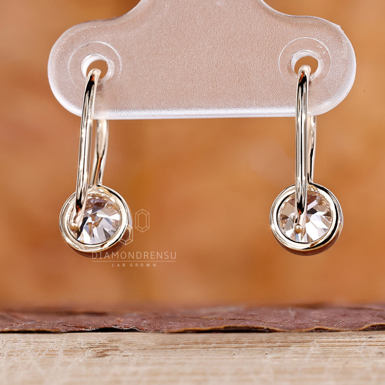 Handmade yellow gold diamond earrings.