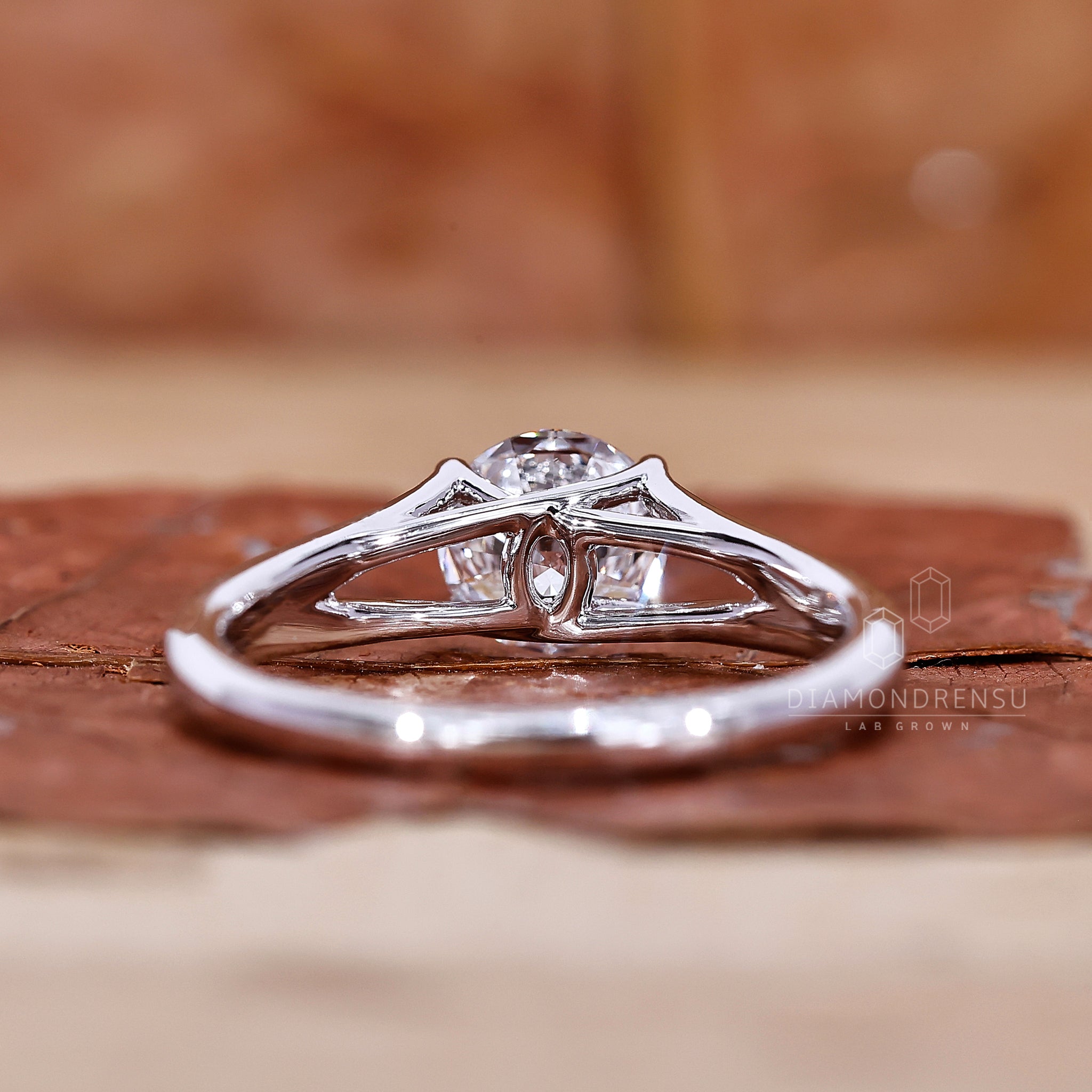 This custom ring uses a 4 prong setting and round cut diamond.