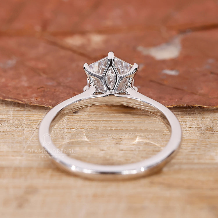 Custom UK engagement ring in a cathedral style.
