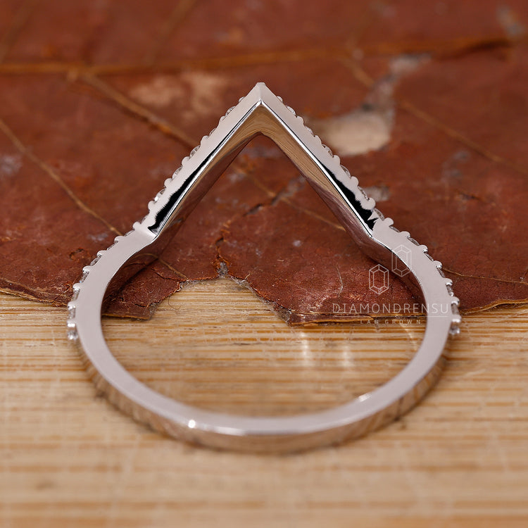 Custom diamond band with a half eternity layout in white gold.