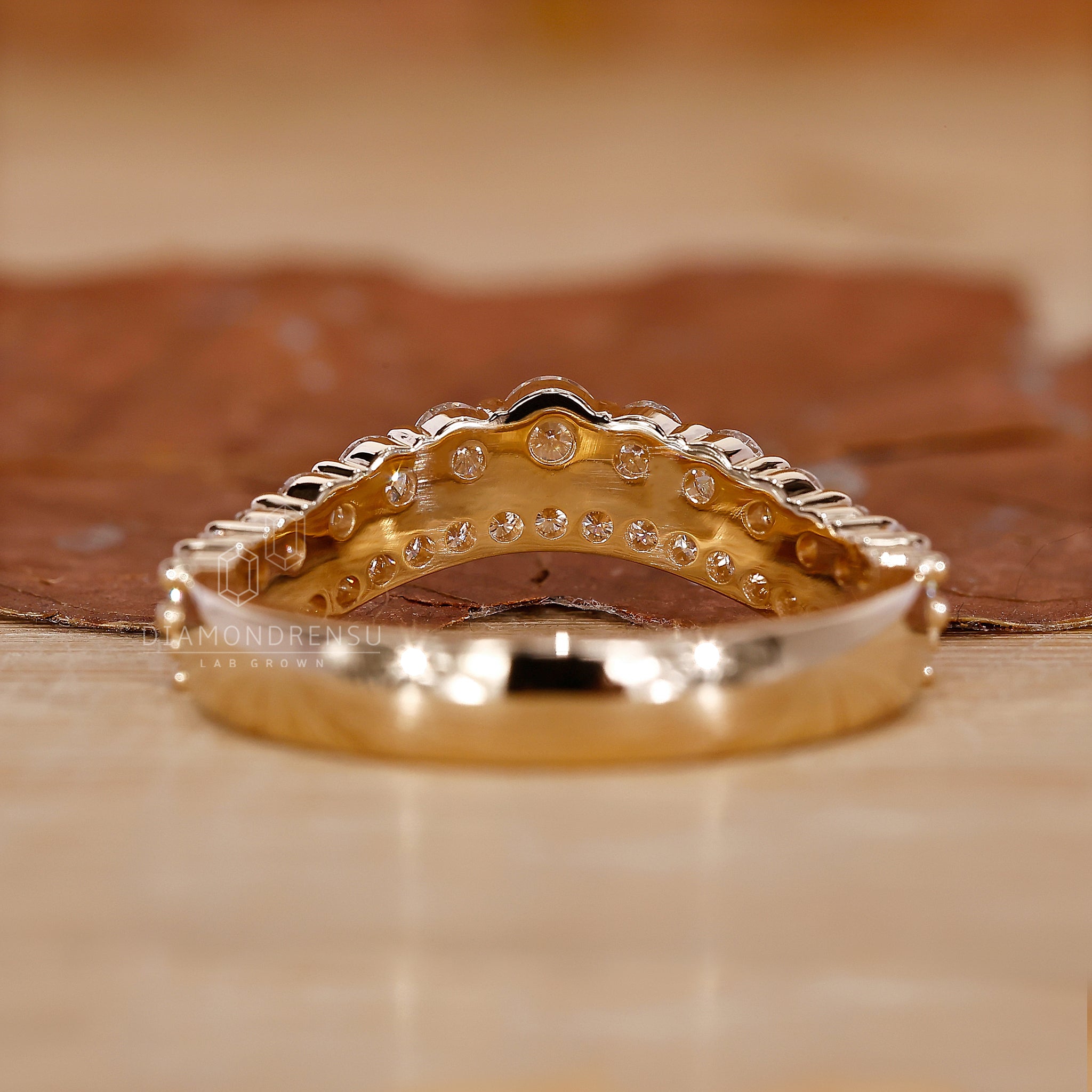 Lab diamond wedding band with curved design.