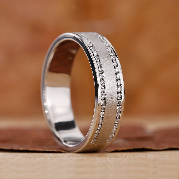 Mens white gold ring with round diamonds in a bold double row design.