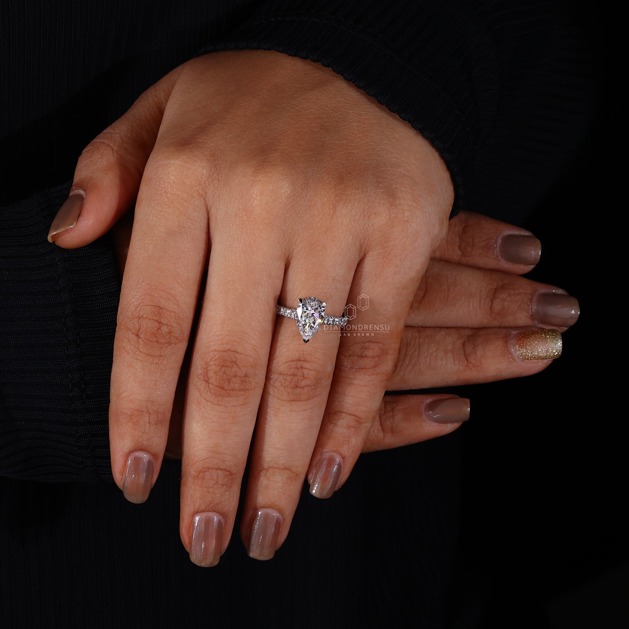 White gold pear engagement ring designed for a sophisticated style.