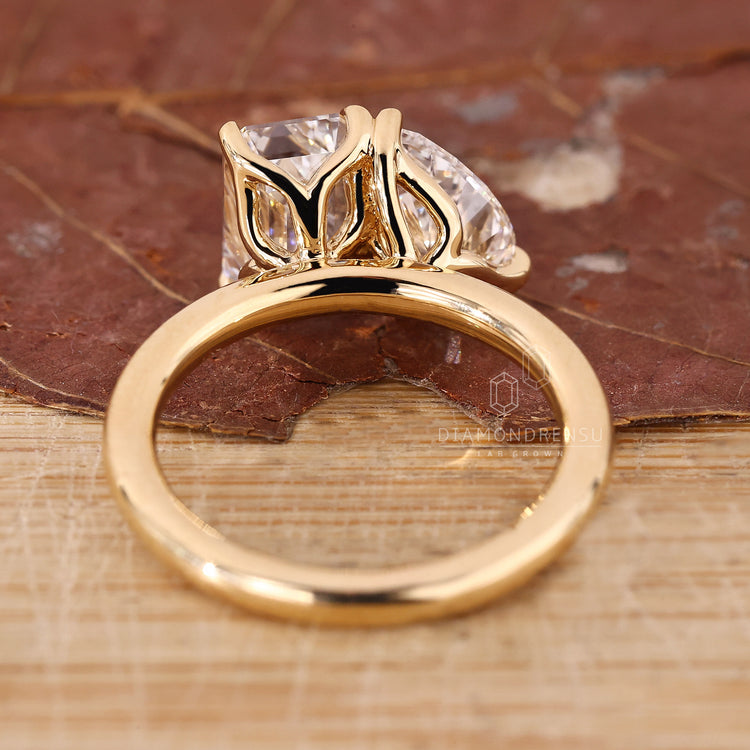 Emerald cut and pear cut lab diamond ring