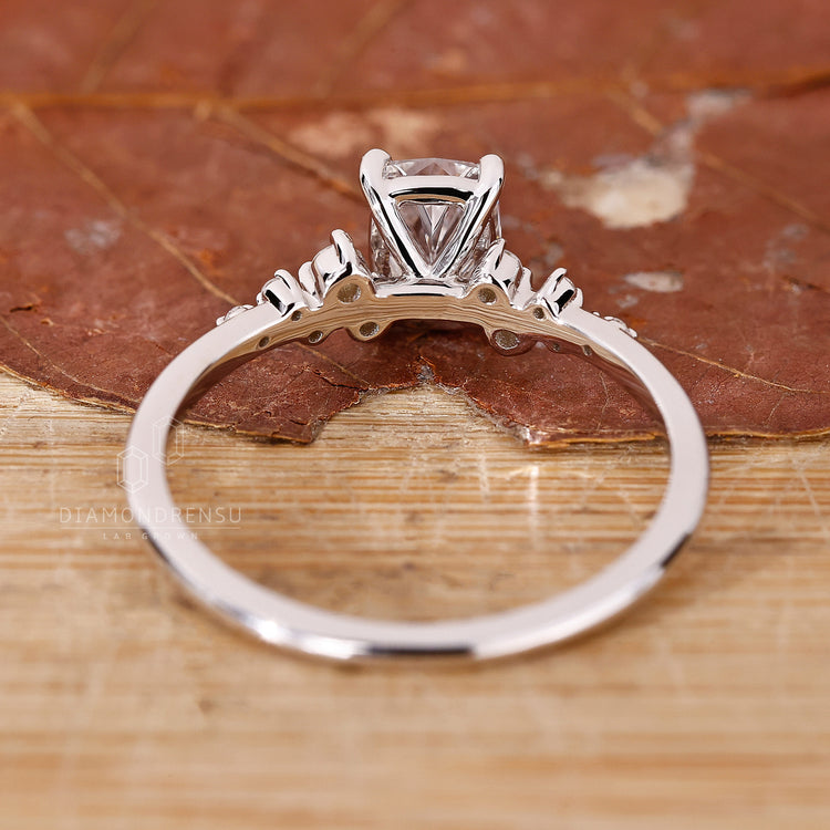 Lab grown diamond ring with unique cushion cut and prong setting.